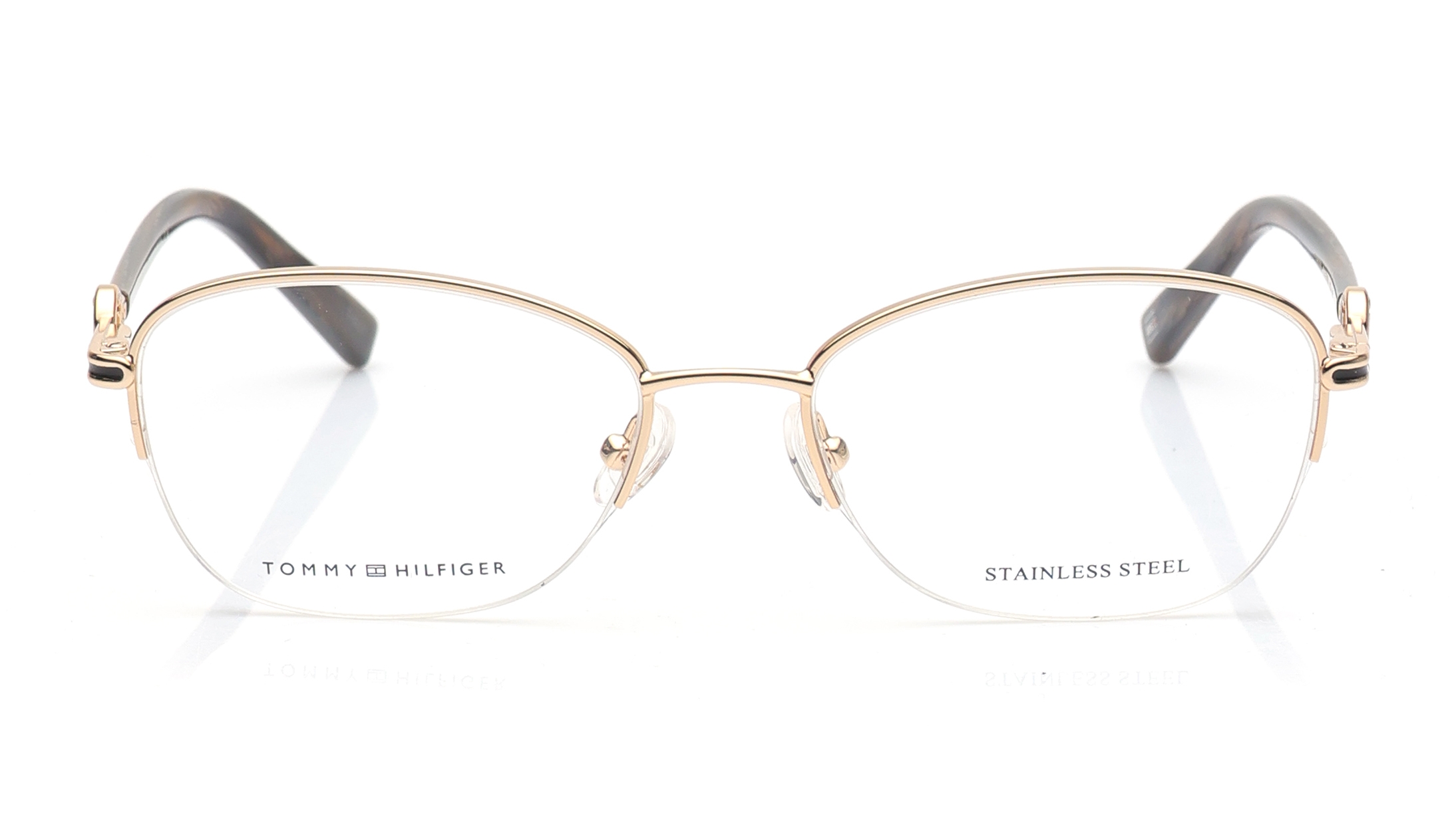 Image 1 of Gold Oval Eyeglasses for Women from Tommy Hilfiger Available at Titan Eye+
